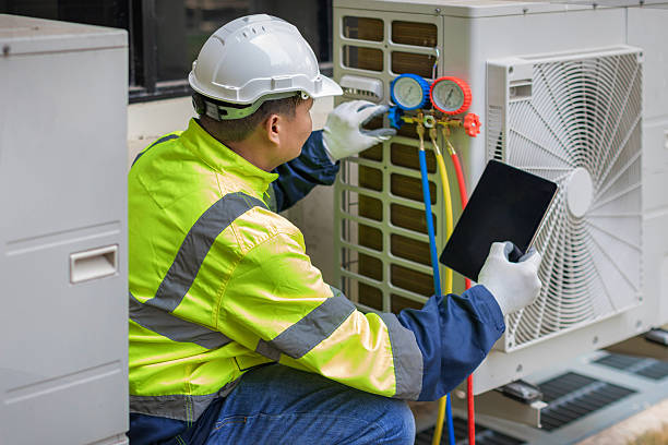 Professional Heat Pump Repair technician working in Milton, MA